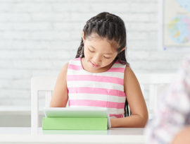 Kid using tablet to study